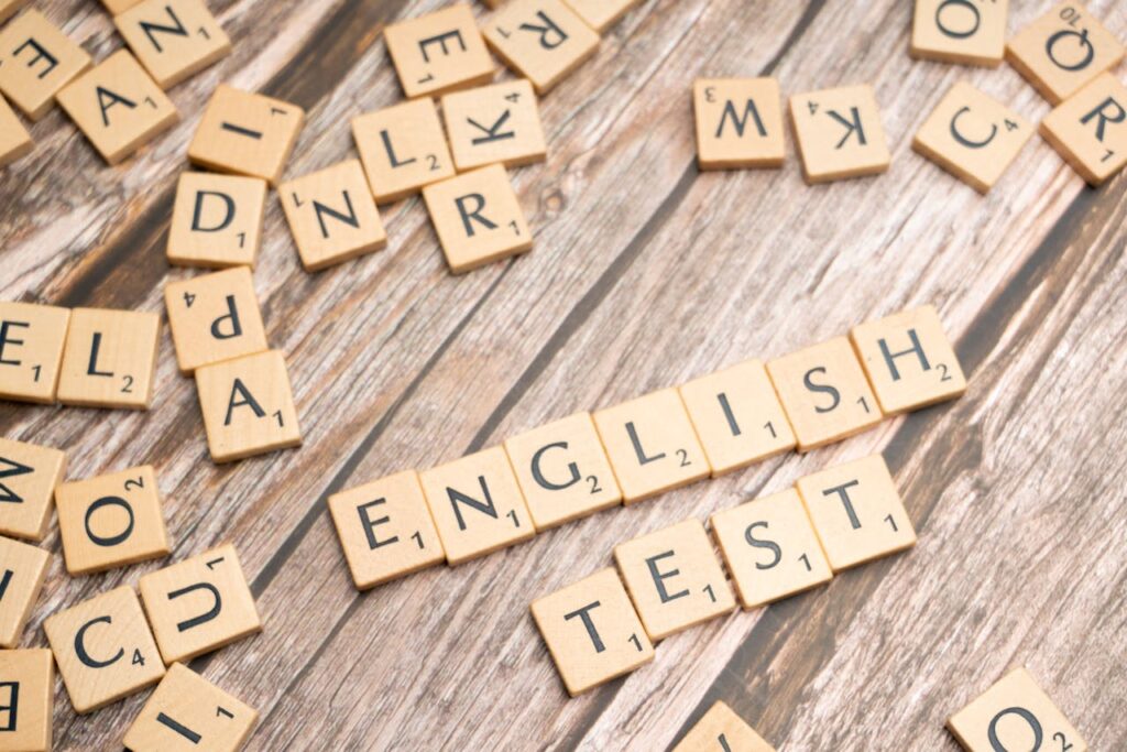 pexels-photo-19902304 The word english test is spelled out in scrabble tiles
