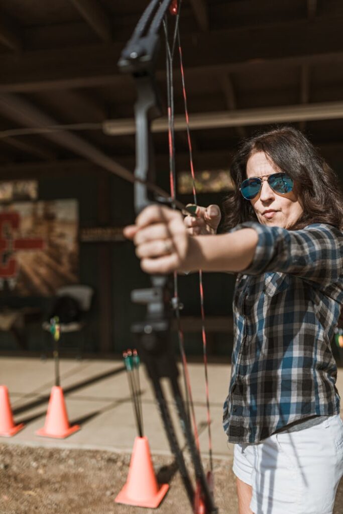 pexels-photo-6669037 Woman Holding a Bow and Arrow and Aiming